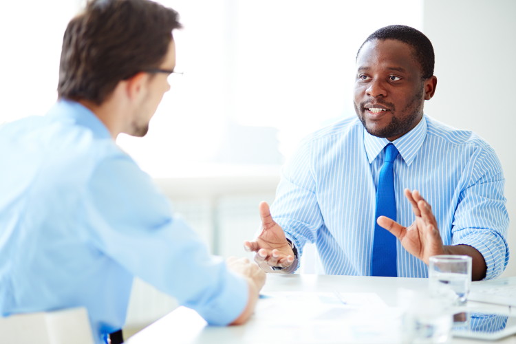 Man communicates expressively in interview